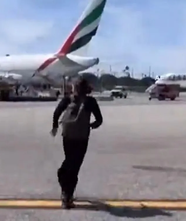 Chaotic Emergency Evacuation at LAX as Passengers Defy Safety Protocols by Dragging Luggage Down Slides