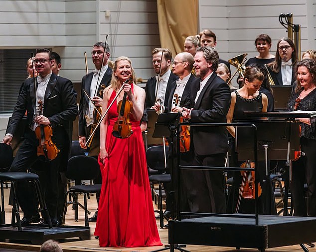 Conductor accidentally knocks £1m violin from violinist's hands during live performance.